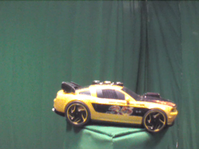 225 Degrees _ Picture 9 _ Yellow Toy Sports Car.png